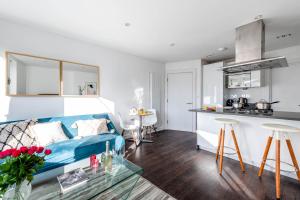 Stunning 1 Bed apartment Kings Cross/St Pancras Farringdon tesisinde bir oturma alanı