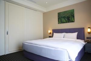 A bed or beds in a room at Fullon Poshtel - Shuili
