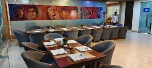 a group of tables and chairs in a restaurant at hotel badri palace in Jodhpur