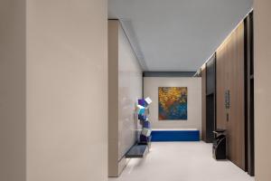 Postel nebo postele na pokoji v ubytování Hampton by Hilton Guangzhou Luoxi