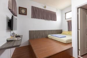 Giường trong phòng chung tại Jinshawan B&B