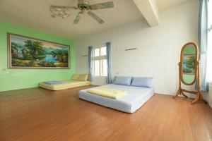 Giường trong phòng chung tại Jinshawan B&B