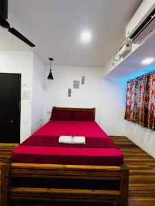 Postel nebo postele na pokoji v ubytování Shanthu Stayhi Seaview