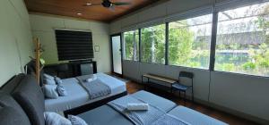 Una cama o camas en una habitación de Gopeng Riverstones Rainforest Retreat