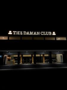 a building with a sign that reads the damsan club at The Daman Club in Daman