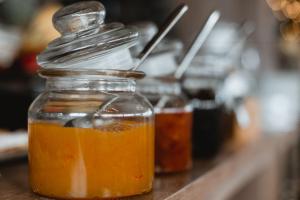 a mason jar filled with honey on a counter at Marpessa Hotel & Spa in Agrinion