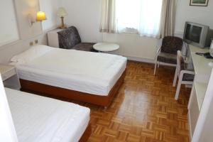 Ein Bett oder Betten in einem Zimmer der Unterkunft Hotel Wasserpalast - breakfast for free!!!