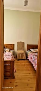 Postel nebo postele na pokoji v ubytování Rita Gujejiani Guest House