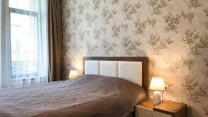 Llit o llits en una habitació de Dani Lux Apartments