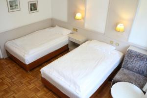 Ein Bett oder Betten in einem Zimmer der Unterkunft Hotel Wasserpalast - breakfast for free!!!