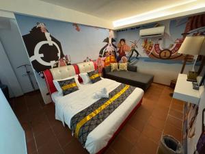 a bedroom with a bed with a painting on the wall at Dsney Boutique Hotel in Melaka