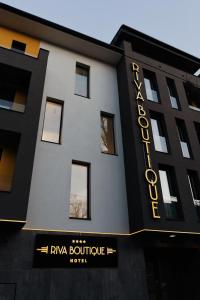 a building with a sign that reads riya boutique hotel at RIVA Boutique Hotel in Szeged
