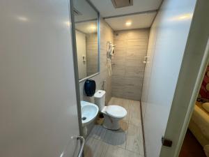 a small bathroom with a toilet and a sink at Dsney Boutique Hotel in Melaka