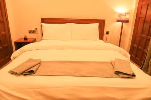 Posteľ alebo postele v izbe v ubytovaní River House Lodge International