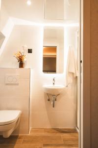 a bathroom with a sink and a toilet at La Maison Montparnasse in Paris