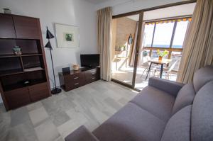 A seating area at ARENA 8 Levante Beach