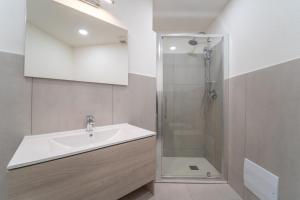 a bathroom with a sink and a shower at Brorent Affittacamere moro dream rooms in Olbia