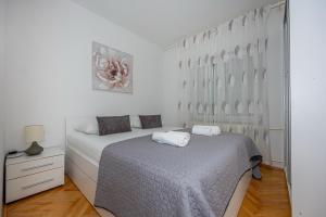 Posteľ alebo postele v izbe v ubytovaní Apartment Lisinski