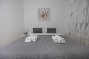 Posteľ alebo postele v izbe v ubytovaní Apartment Lisinski