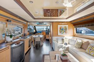 a living room and dining area of an rv at Yacht Joy 4 cabin in Porto Cervo