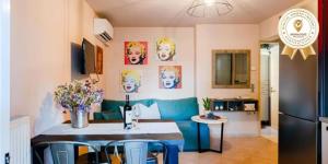 A television and/or entertainment centre at Urban Living, Minicasa Nomad - Kalamata's Hideaway