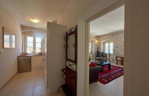 a view of a living room and kitchen from a door at Palate Verona in Prčanj