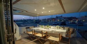 a table on the deck of a boat at Yacht Joy 4 cabin in Porto Cervo