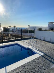 a swimming pool in the middle of a patio at Mojacar Luxury in Mojácar