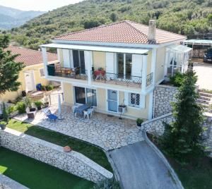 an aerial view of a house with a stone wall at Villa Claudia in Apolpaina