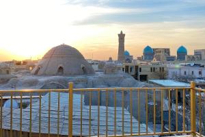 a view of a mosque in a city with snow at NANOSH EAST HOTEL in Bukhara