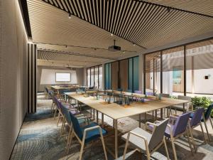 a conference room with a long table and chairs at TTC Van Phong Bay Resort - Himalaya Sauna & Steam Retreat Included in Ninh Hòa