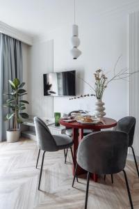 a dining room with a table and chairs at MameHome Apartments in Krakow