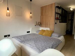 Postel nebo postele na pokoji v ubytování Apartmani Audacia Crikvenica