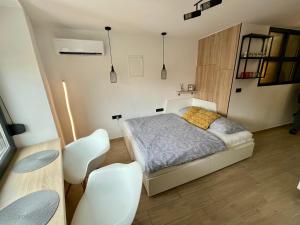 Postel nebo postele na pokoji v ubytování Apartmani Audacia Crikvenica