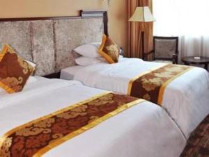 เตียงในห้องที่ Chang An Hotel