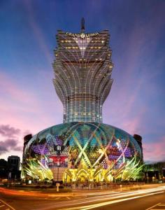 a large building with a tower on top of it at Grand Lisboa Hotel in Macau