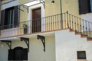 a building with a staircase on the side of it at Dimora cAmelia in Lucera