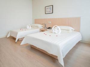 Katil atau katil-katil dalam bilik di Jinjiang Inn E'ling Cultural and Creative Second Factory