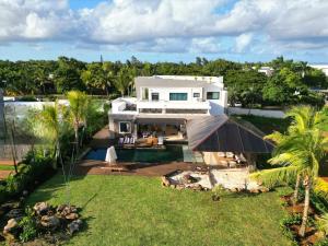 an aerial view of a house with a yard at Golf View Villa in Roches Noires