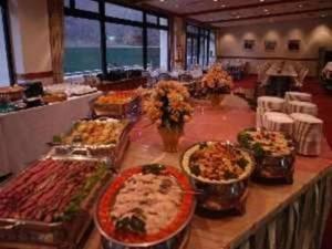 a buffet line with many different types of food at Izu Inatori Sports Villa in Higashiizu
