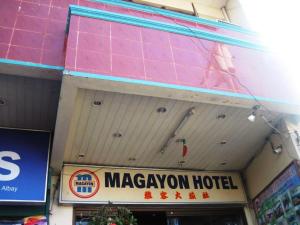 a magayaon hotel sign on the side of a building at Magayon Hotel in Buenavista