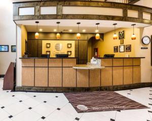 a lobby with a reception desk in a hospital at Comfort Inn & Suites in Winnie