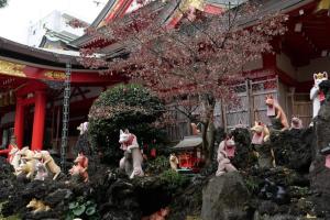 a group of figurines on rocks in front of a building at Kawasaki Green Plaza Hotel in Imai-kamichō