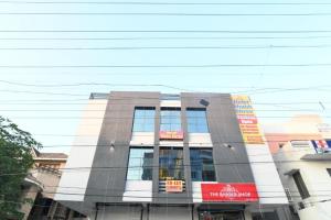 a building with a lot of windows on it at Hotel Shubhshree in Indore