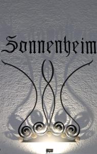 a pair of scissors spelling the word spirituality at Gästehaus Sonnenheim in Thaur