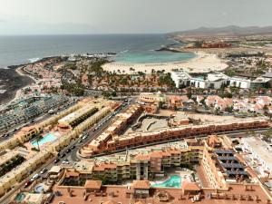 an aerial view of a resort near the beach at Hotel Chatur Costa Caleta in Caleta De Fuste