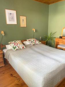 a bedroom with a large bed with two pillows at Cozy home in Tallinn in Tallinn