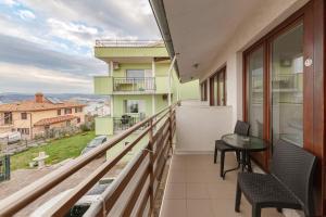 a balcony with a table and chairs and a view at Studio Vesna & Žan in Koper