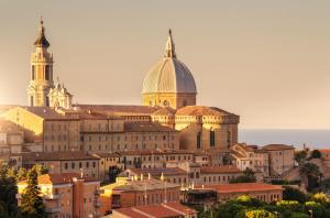 a view of a city with a cathedral and buildings at AURUM Affittacamere in Loreto