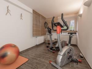 a gym with two exercise bikes in a room at Appartementresidenz 4 Seasons in Timmendorfer Strand